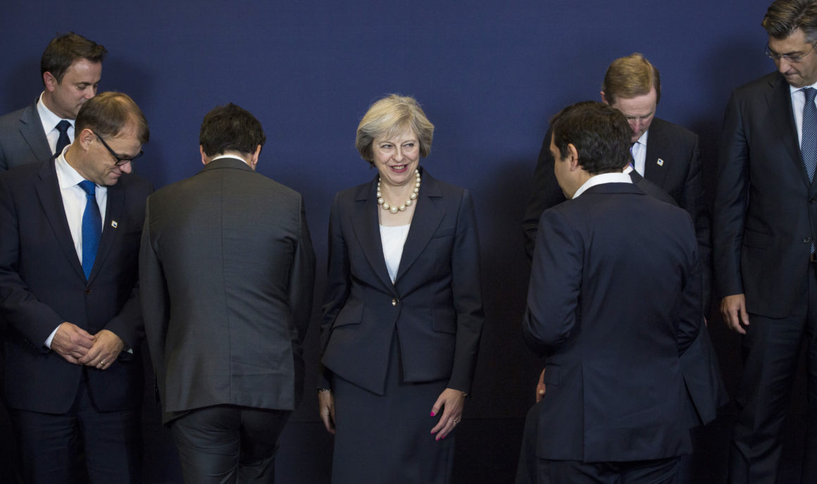 BRUSSELS, BELGIUM - OCTOBER 20: British Prime Minister Theresa May (C) stands in position as other leaders of European Union countries assemble for a group photo at the Council of the European Union on the first day of a two day summit on October 20, 2016 in Brussels, Belgium. Theresa May is attending her first EU Council meeting as the British Prime Minister. The government's Brexit strategy continues to be debated in the UK with Article 50 of the Lisbon treaty to be triggered by the end of March 2017. Article 50 notifies the EU of a member state's withdrawal and the EU is then obliged to negotiate a withdrawal agreement. The process will take two years seeing the UK finally withdraw from the Union in March 2019. (Photo by Jack Taylor/Getty Images)