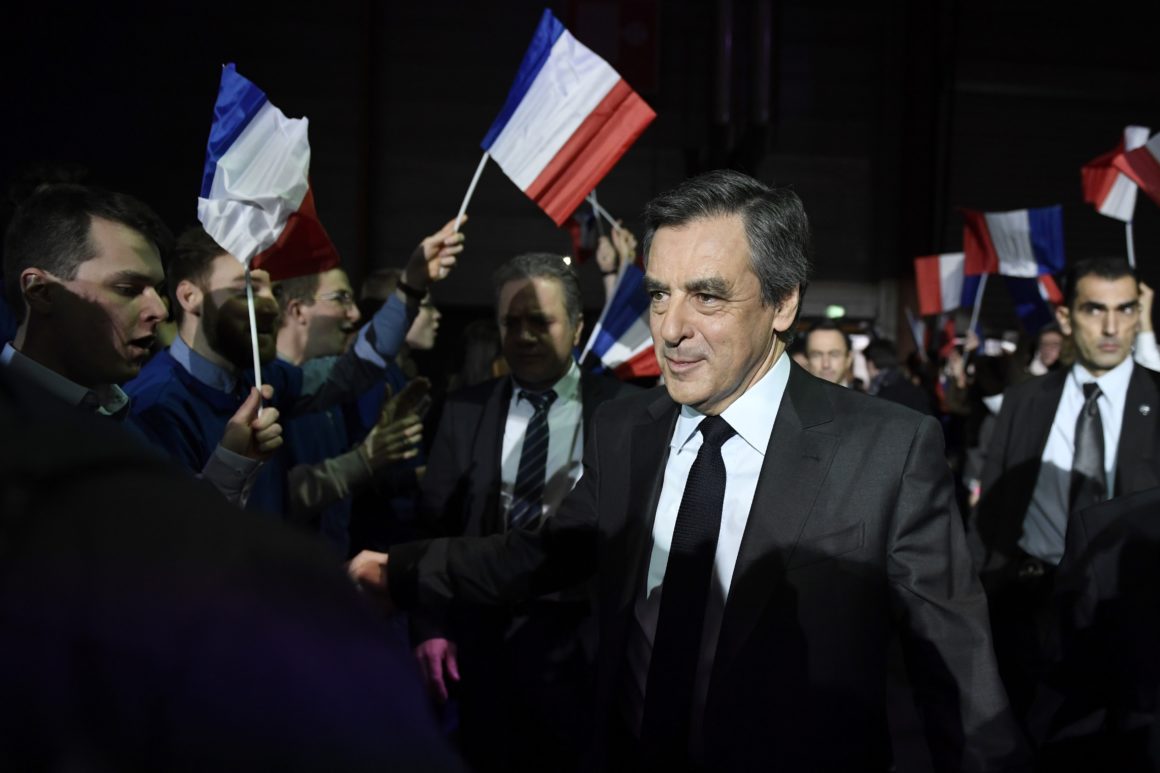 epa05760163 Supporters greet former French Prime Minister and Les Republicains political party candidate for the 2017 presidential election Francois Fillon (C) and his wife Penelope Fillon (not pictured) as they arrive for a political rally in Paris, France, 29 January 2017. Francois Fillon has come under pressure to explain the previous employment of his wife as parliamentary aide while he was a MP and to give details of the work she did. French MPs are allowed to employ family members as aides. EPA/ERIC FEFERBERG/POOL MAXPPP OUT