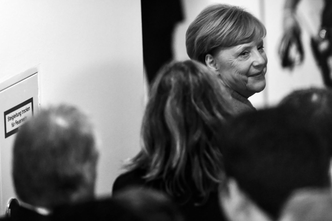 BERLIN, GERMANY - SEPTEMBER 24: (EDITOR'S NOTE: This image was converted from color to black and white) German Chancellor and Christian Democrat (CDU) Angela Merkel smiles after leaving her election party and reacting to initial results that give the party 33,1% of the vote, giving it a first place finish, in German federal elections on September 24, 2017 in Berlin, Germany. Chancellor Merkel is seeking a fourth term and coming weeks will likely be dominated by negotiations between parties over the next coalition government. (Photo by Alexander Koerner/Getty Images)