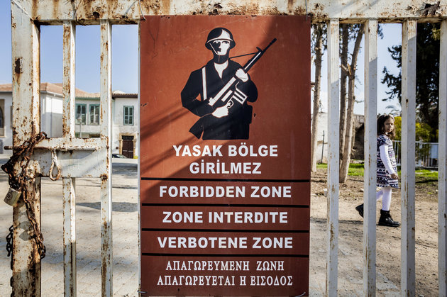 Warning turkish army banner close to the green line that separates the turkish and the cypriot side of Nikosia city, Cyprus, on 3 December 2017, warns for not access to a  military zone. After the occupation of Cyprus by turkish troops in 1974, Nikosia was separated in two zones, Turkey controlling the north side and Cyprus the south. (Photo by Celestino Arce/NurPhoto via Getty Images)