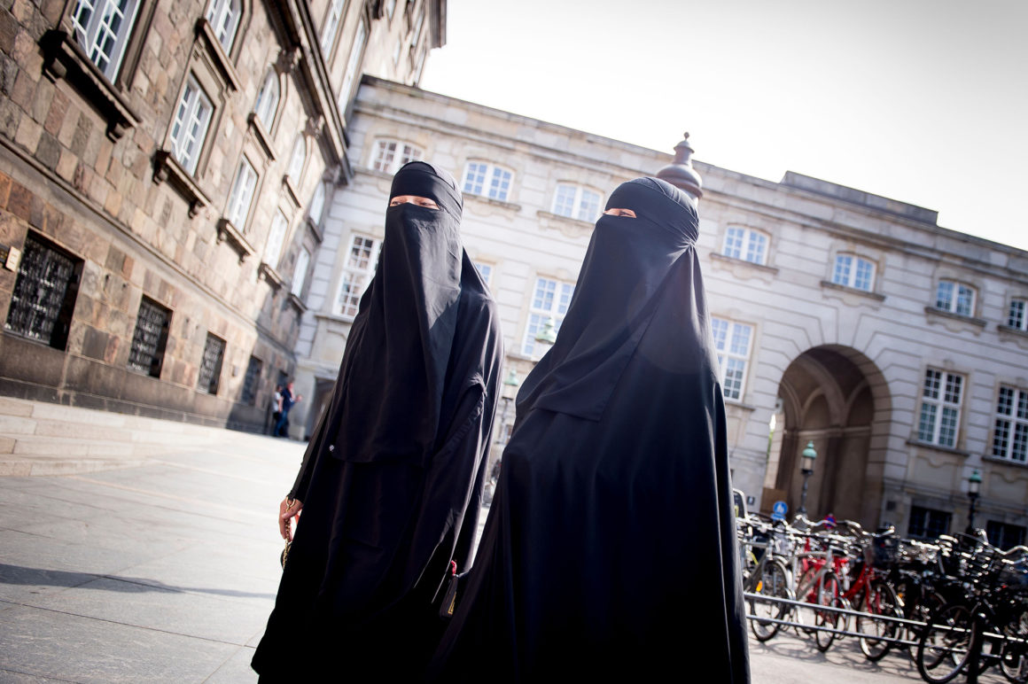 Women wearing niqab are pictured in front of the Danish Parliament in Copenhagen, Denmark, on May 31, 2018. - The Danish parliament on Thursday, May 31,2018, passed a law banning the Islamic full-face veil in public spaces, becoming the latest European country to do so. (Photo by Mads Claus Rasmussen / Ritzau Scanpix / AFP) / Denmark OUT (Photo credit should read MADS CLAUS RASMUSSEN/AFP/Getty Images)
